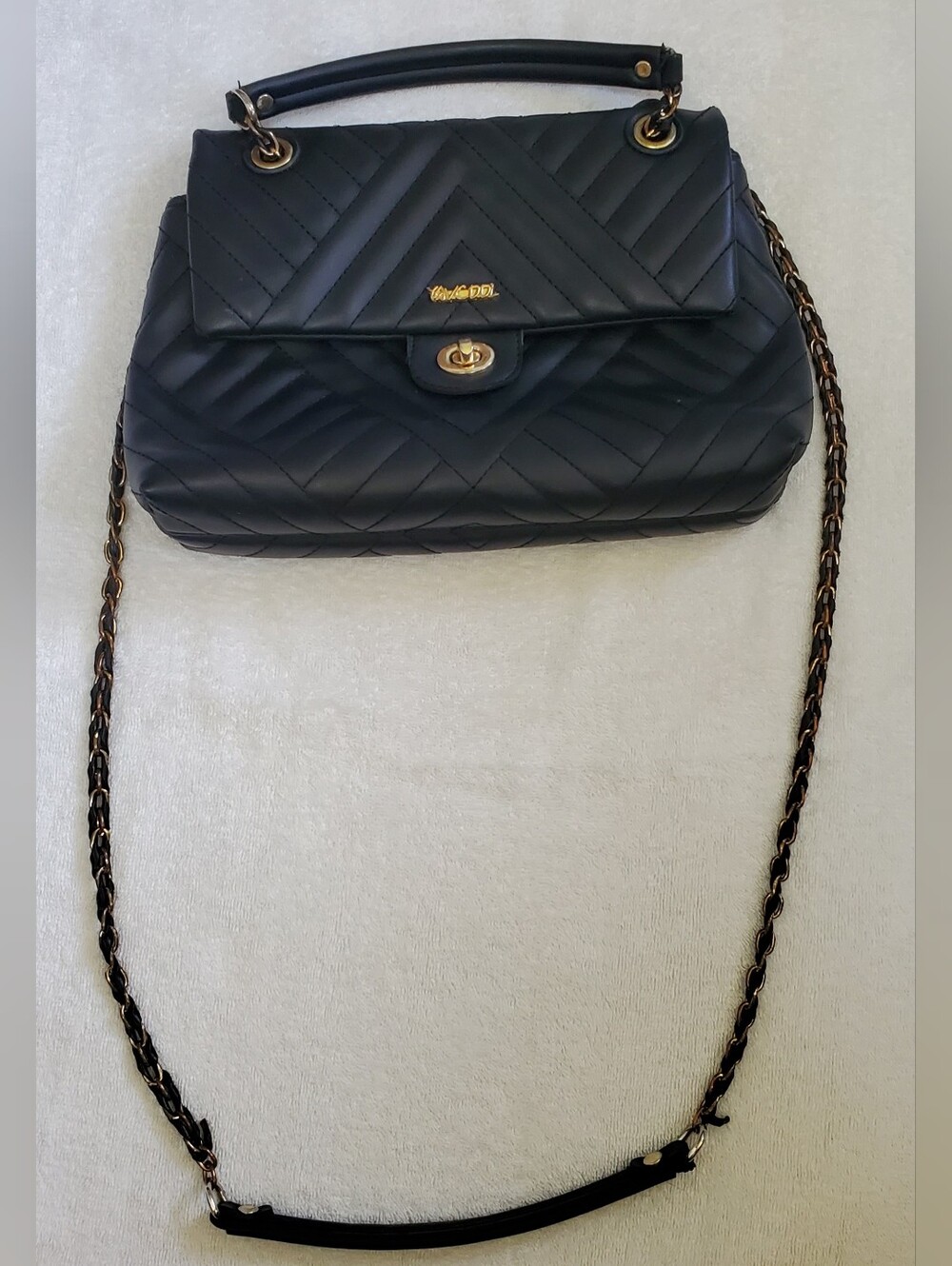 Quilted Black Shoulder Bag with Gold Chain and Top Handle